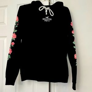 Hollister Black Hooded sweatshirt Size xs extra small With Roses On Sleeve